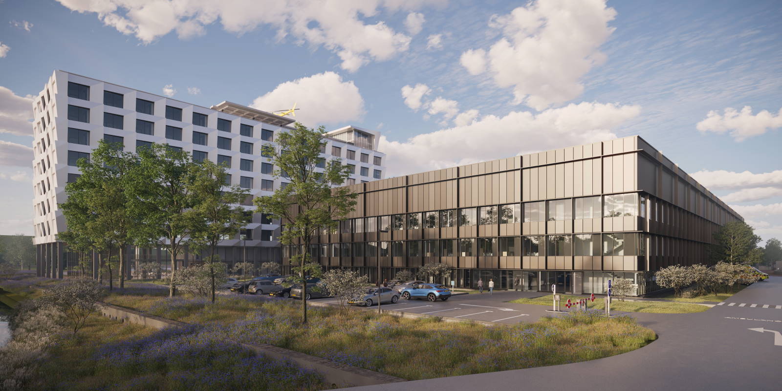 Impressie van het te bouwen acuut centrum en de eerste kliniektoren met helikopterplatform op het dak.